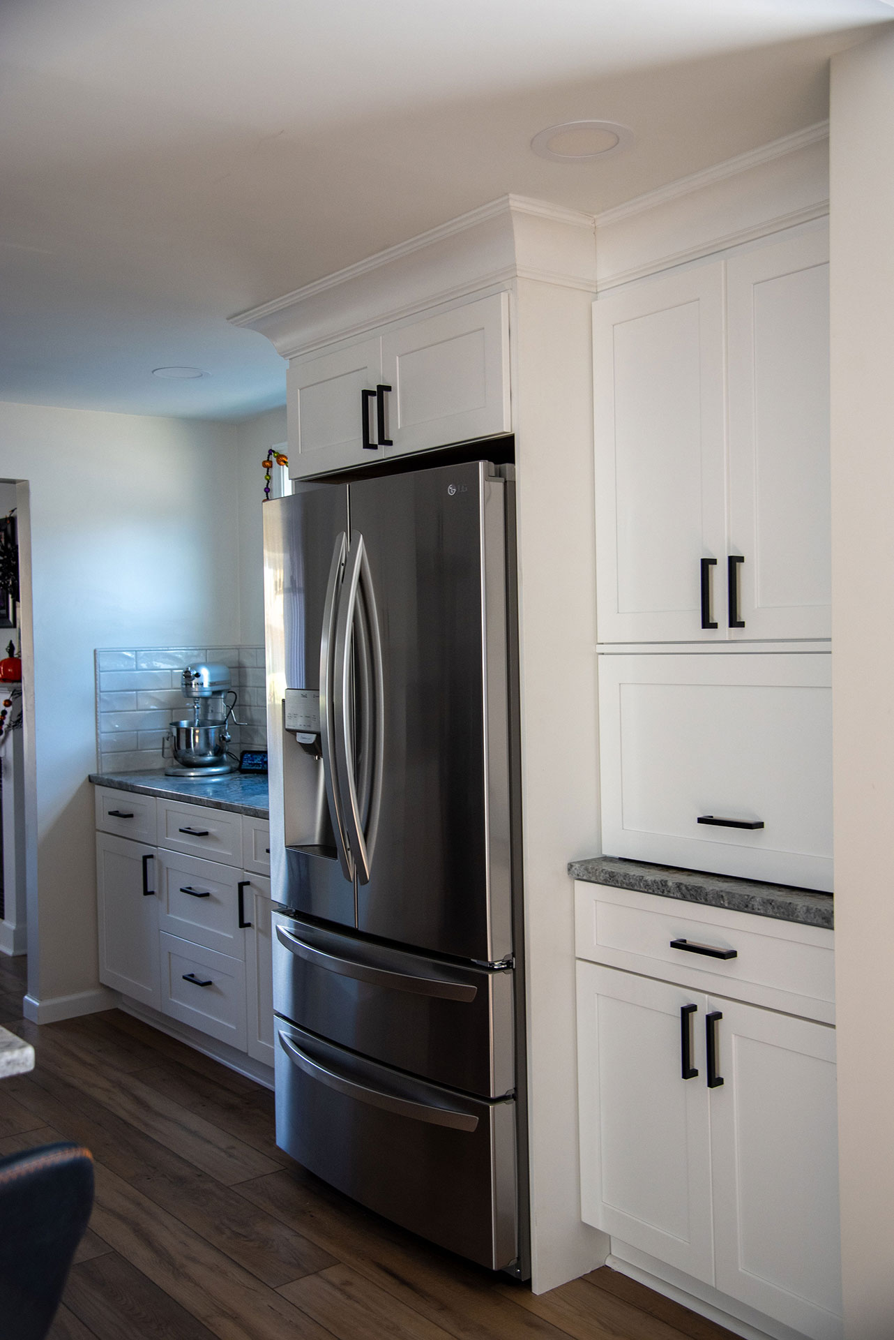 kitchen remodel of new cabinets tile fridge