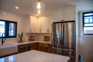 modern kitchen remodel with white black wood and gold theme